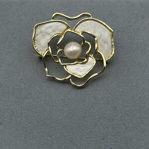 Elegant Gold and White Flower Brooch